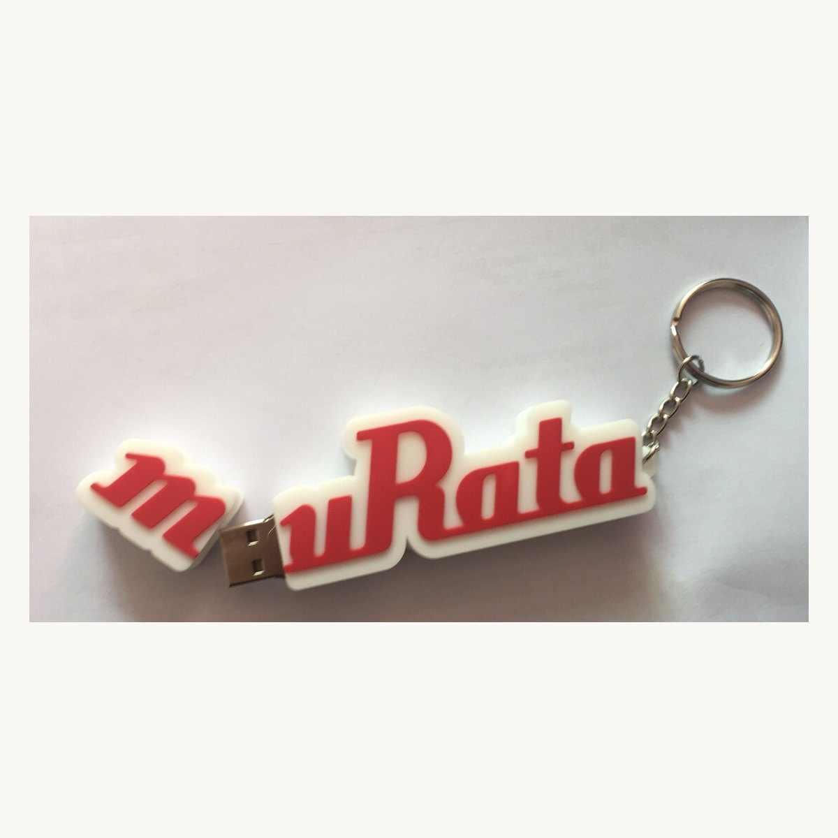 Soft PVC keychain moulded as custom lettering with a metal split ring