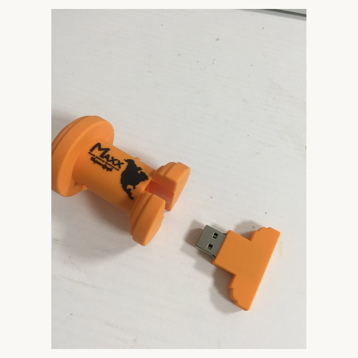 Orange soft PVC tool-shaped keychain with a matching moulded USB drive