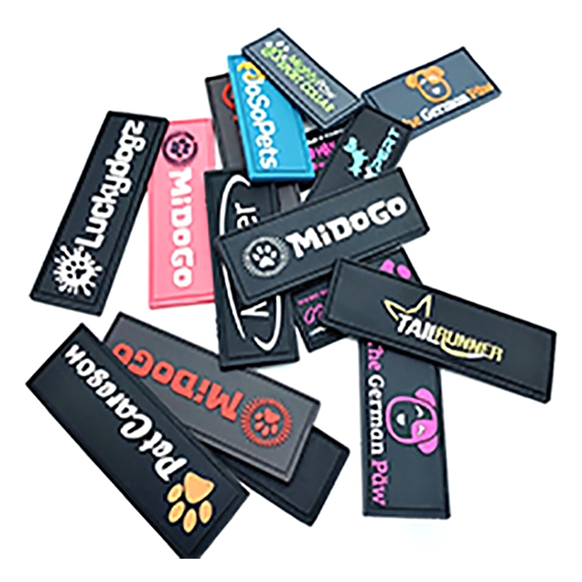 Collection of rectangular soft PVC brand labels with raised logos in multiple colours