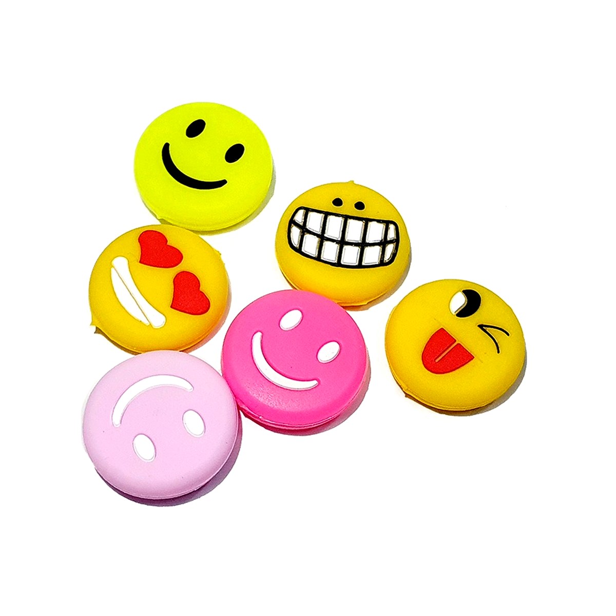 Round smiley-face silicone tennis dampers moulded in bright colours