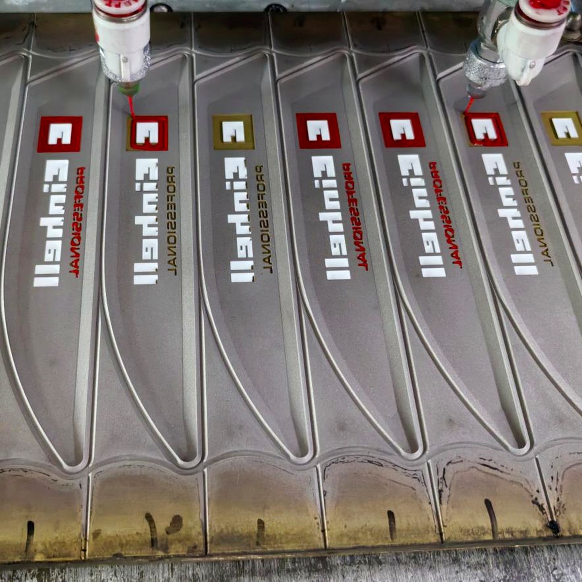 Close view of a moulded silicone brand badge with raised 3D lettering